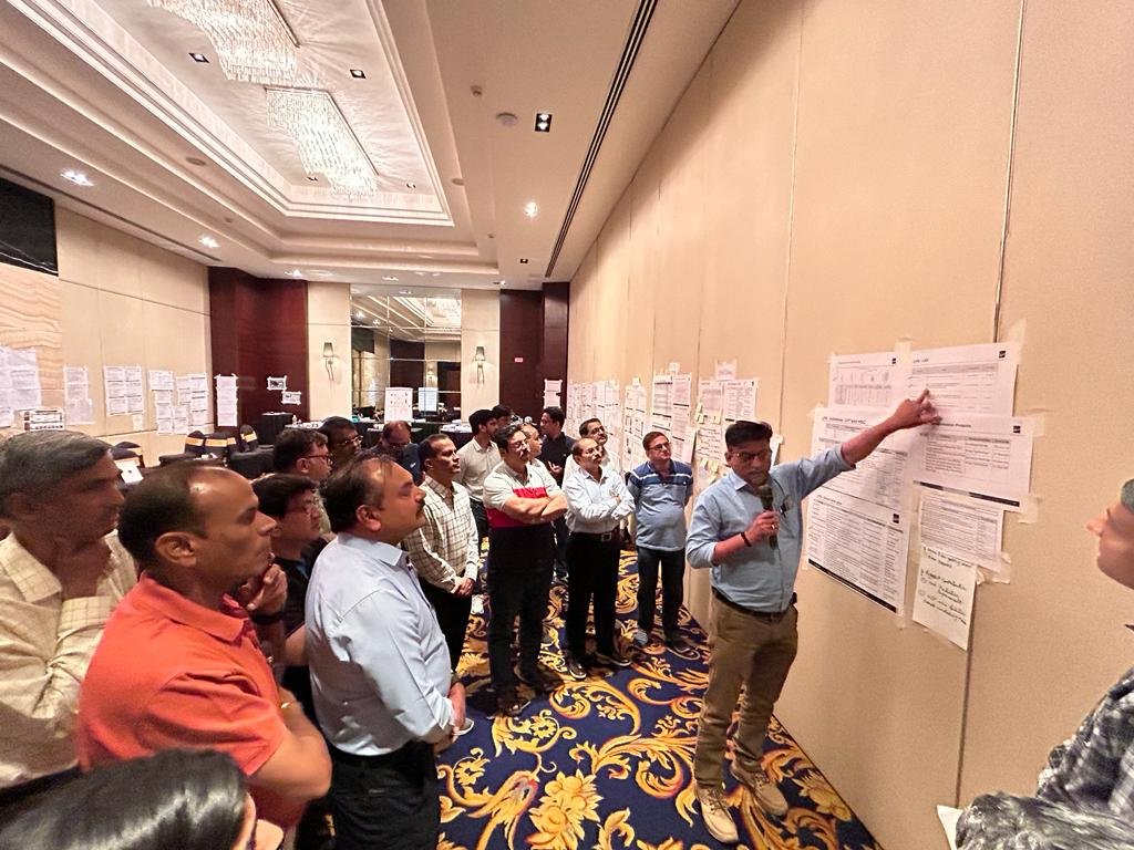 Facilitator presenting a mapped-out initiative plan to the leadership team