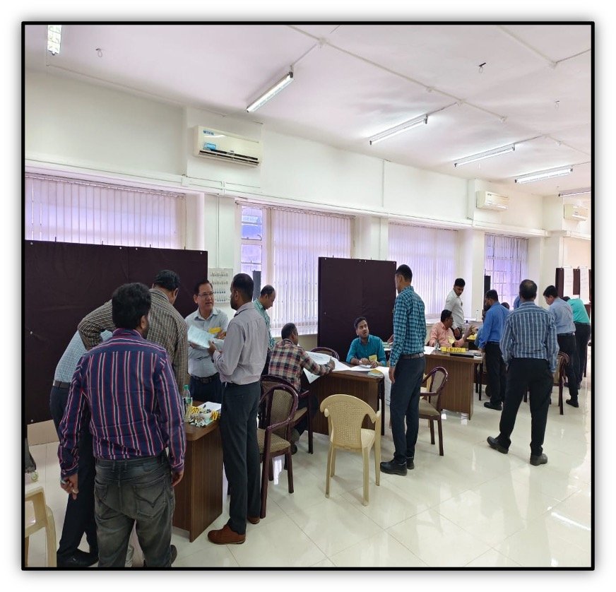 Departments seated at tables during a needs and offers workshop