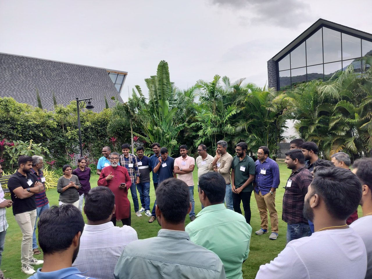 Team gathered in a circle discussing the outcome of the intervention