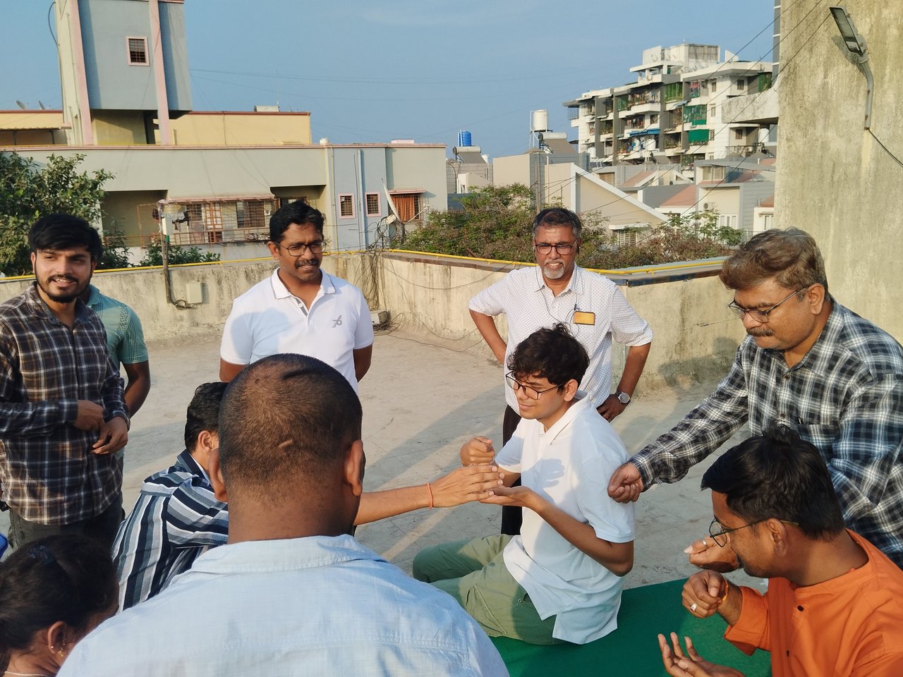 Team working through a hands-on group exercise on a rooftop