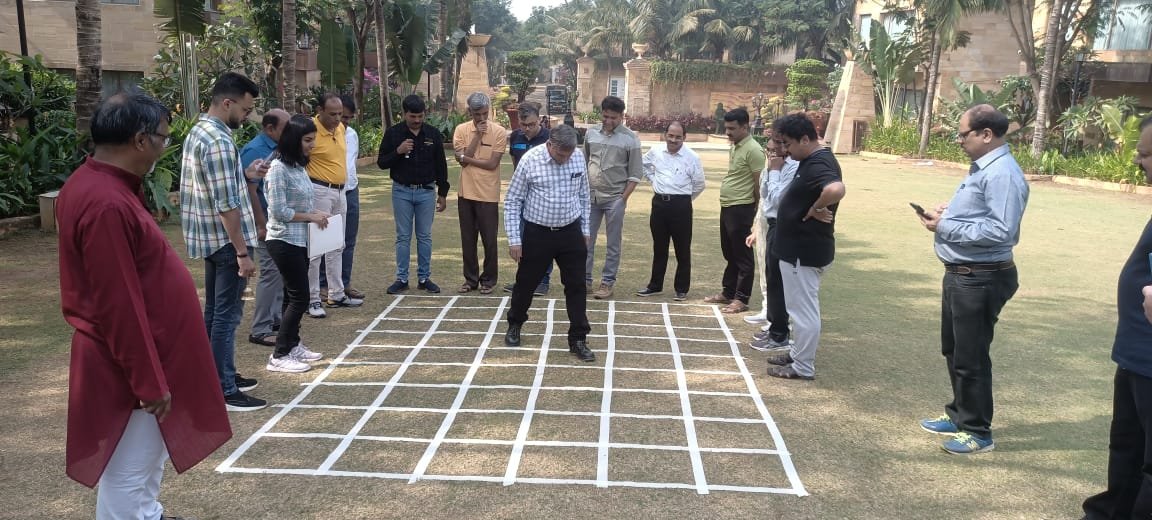 Team working through a structured process exercise outdoors