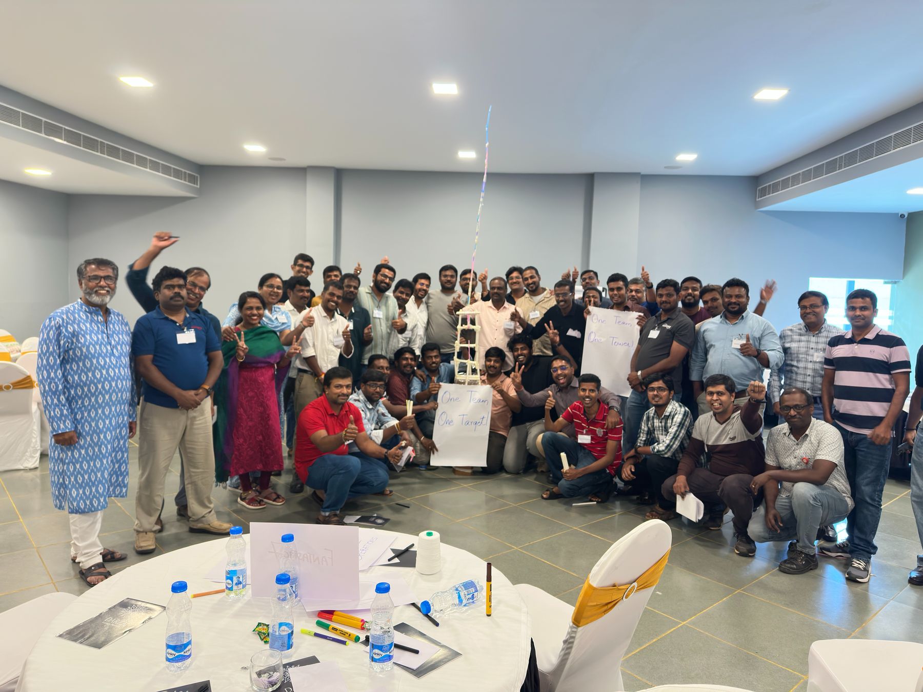 A team celebrating together after a leadership workshop