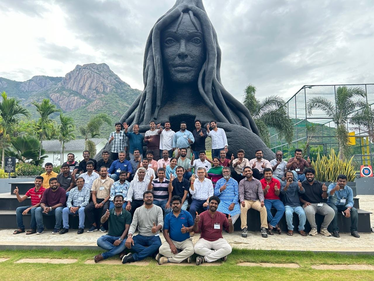 Large team gathered together celebrating a milestone