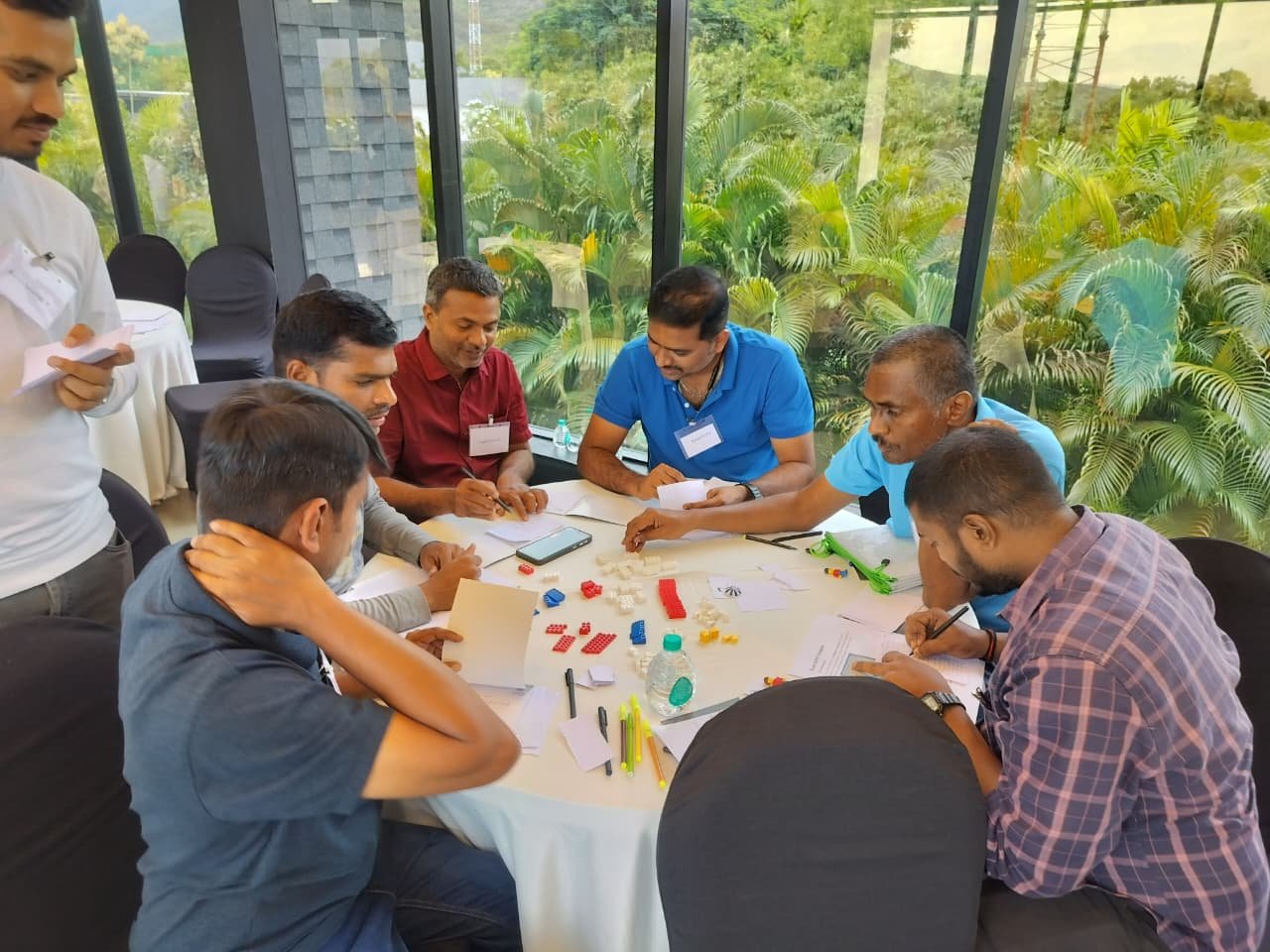 Small group working through a hands-on diagnostic exercise