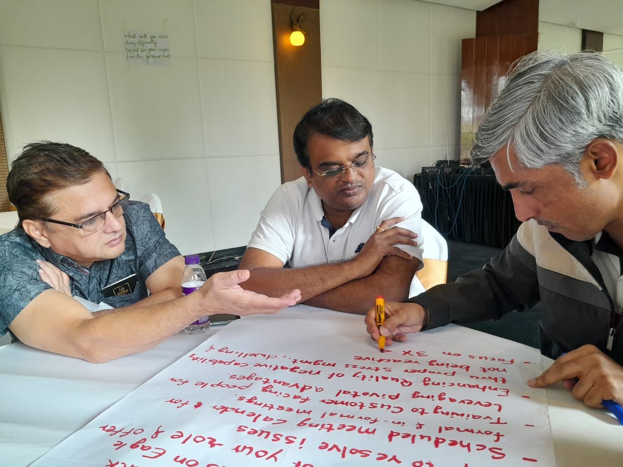 Stakeholders working through discovery notes together