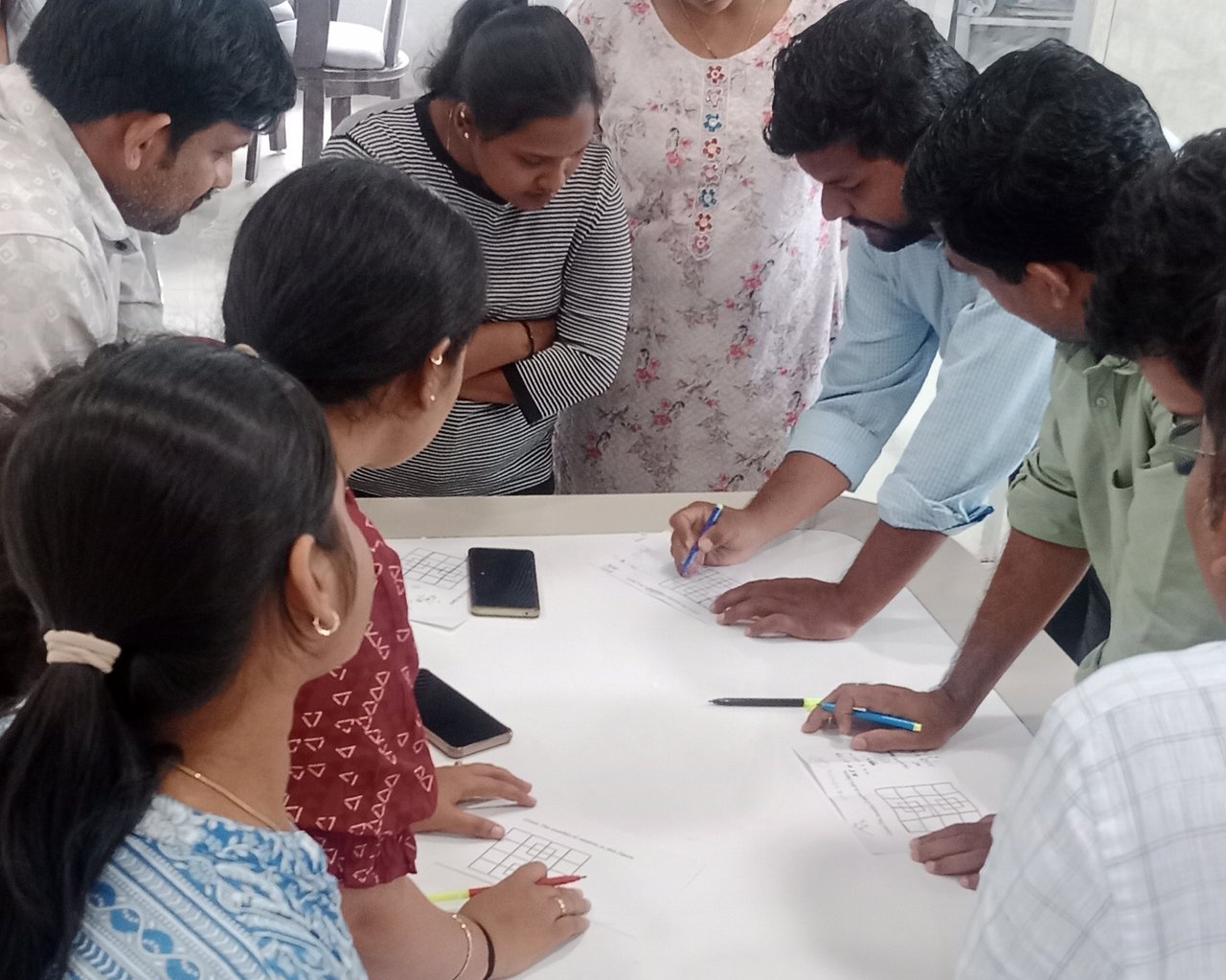 Participants working together on a facilitated learning design exercise