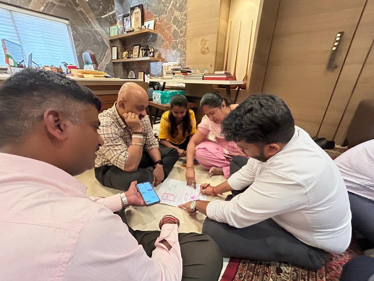 Small group of employees discussing how values translate into daily decisions