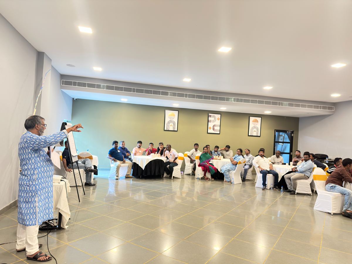 Pawankumar teaching at a flip chart