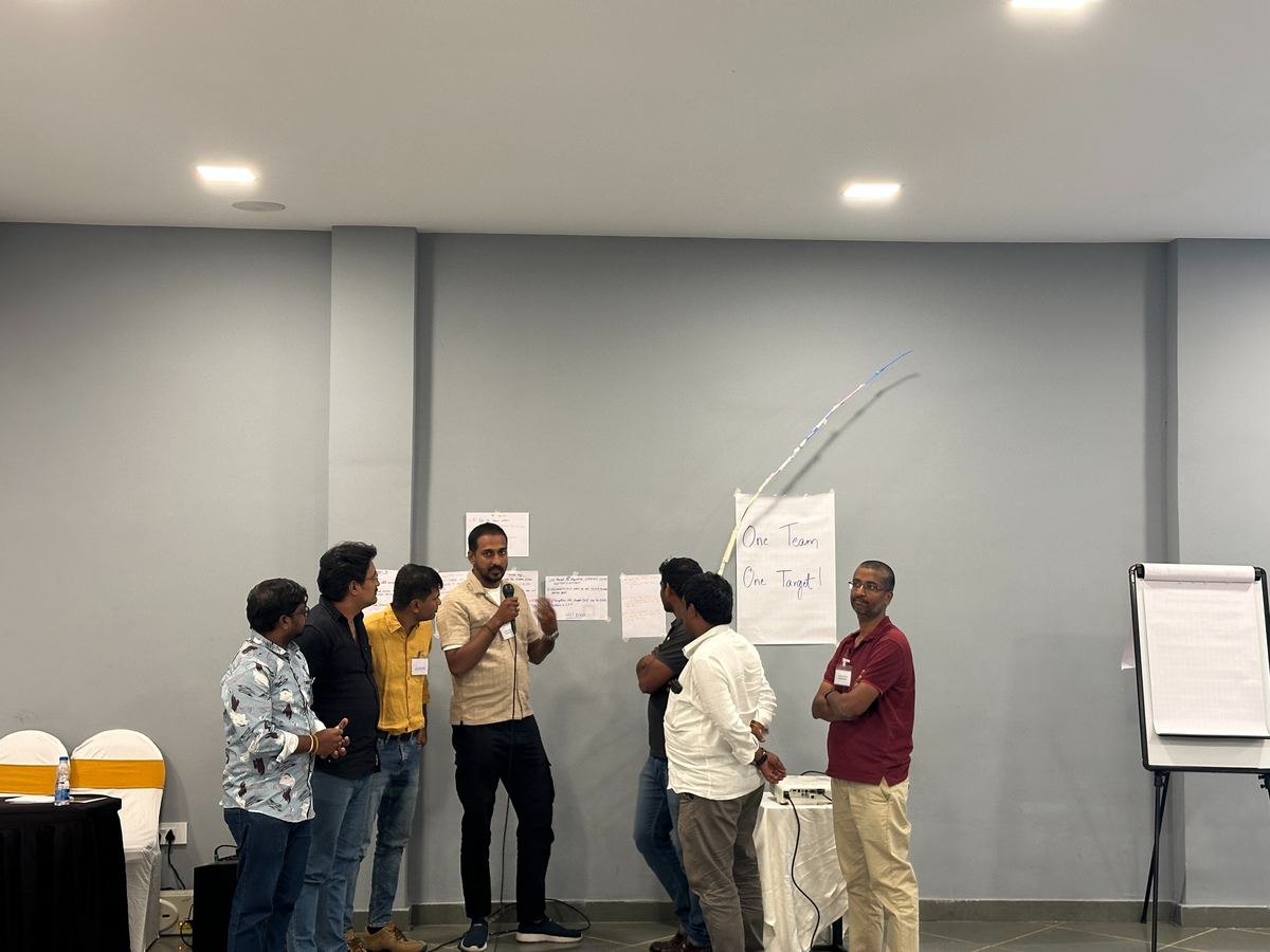 Team presenting their 'One Team, One Target' results
